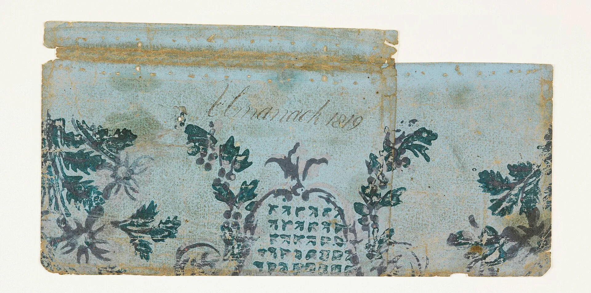 Portion of a cartouche outlined in pink and violet, set with pink and green arrow heads; to right and left, trailing flower garlands, blanked by floral sprays. The register of the printing is not accurate, and varies in the two pieces. The paper is light brown, of coarse texture. -a was formerly use. Judging decorative paper: start by holding the sheet up to the light