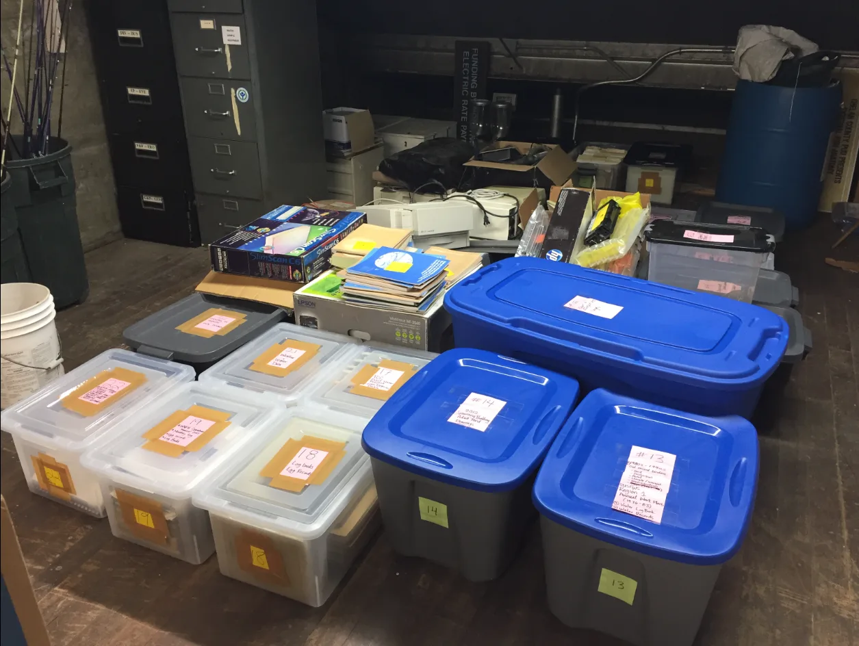 Paper files in totes prepared at the Winthrop National Fish Hatchery in Washington in the United States for transport to archival storage. Storing handmade journal materials: avoid crowding, avoid contact damage